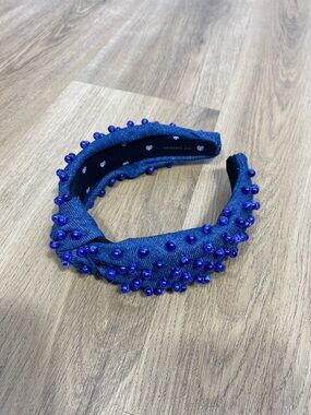 Lele Sadoughi denim knotted headband featuring hand-sewn beaded embellishment
